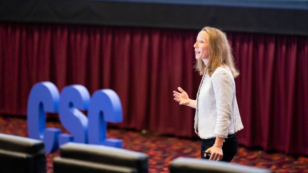 Image of Carine Gursky, Head of Strategic Customer Success at Stripe, speaking at a Customer Success Festival
